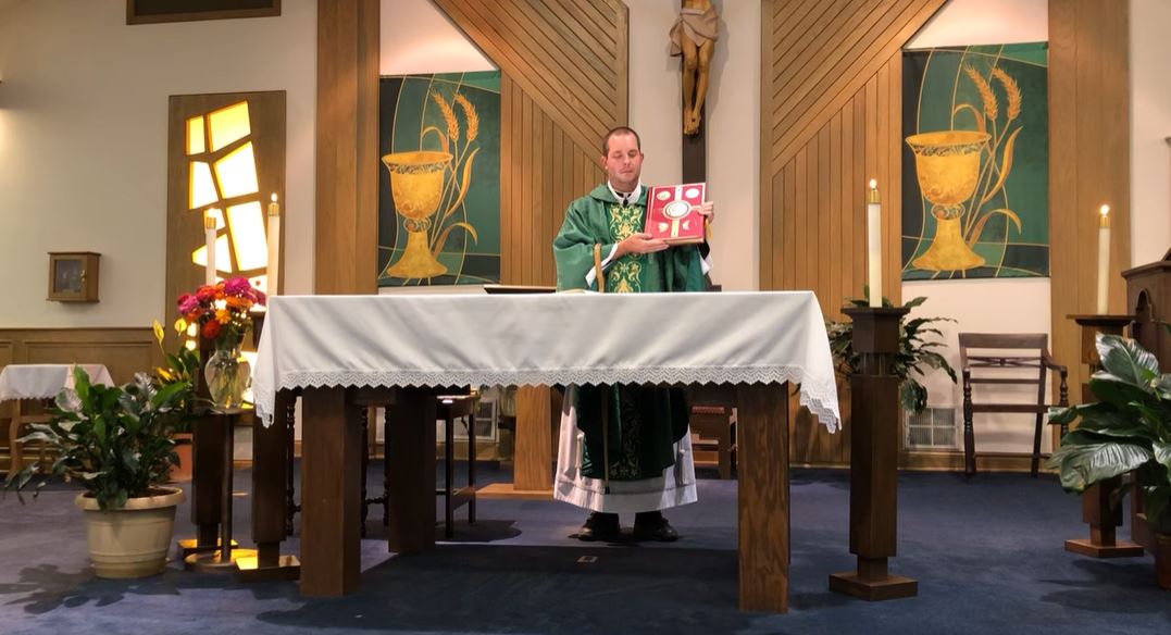 Fr. Jamie behind the alter during Mass